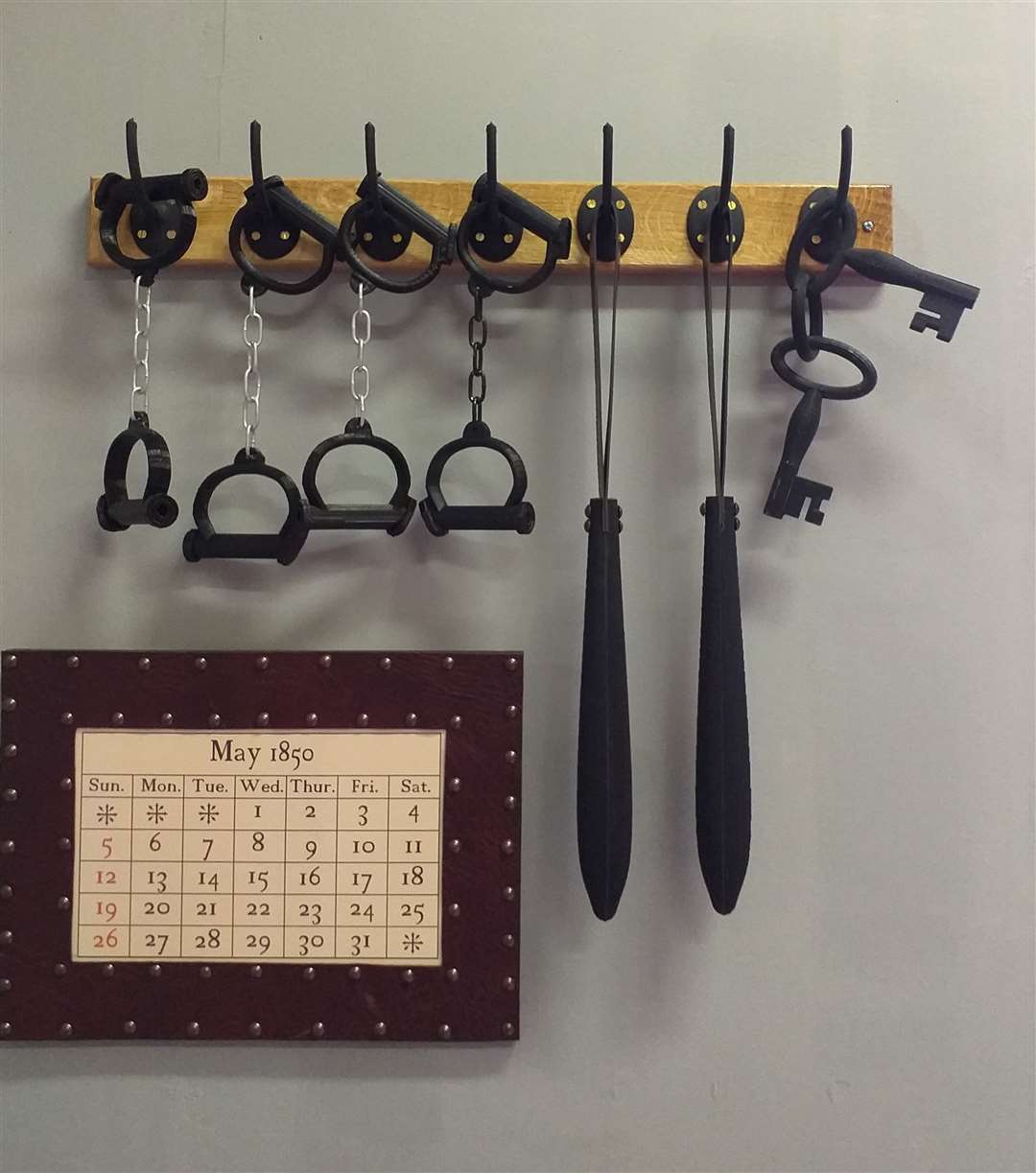 Historic truncheons, handcuffs and keys.