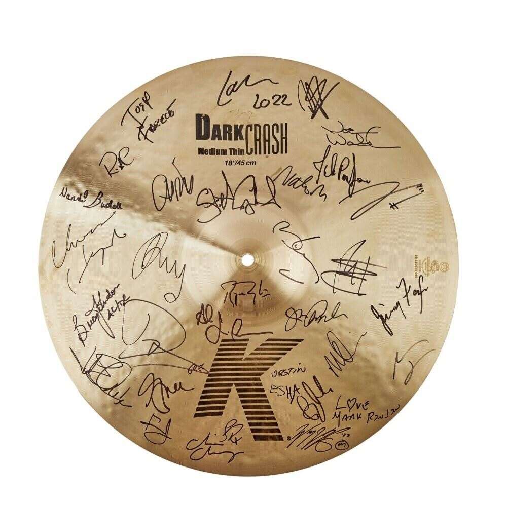 The auction features a collection of guitars, cymbals and drum skins, signed by musicians who performed at the gigs (Julien’s Auctions/PA)