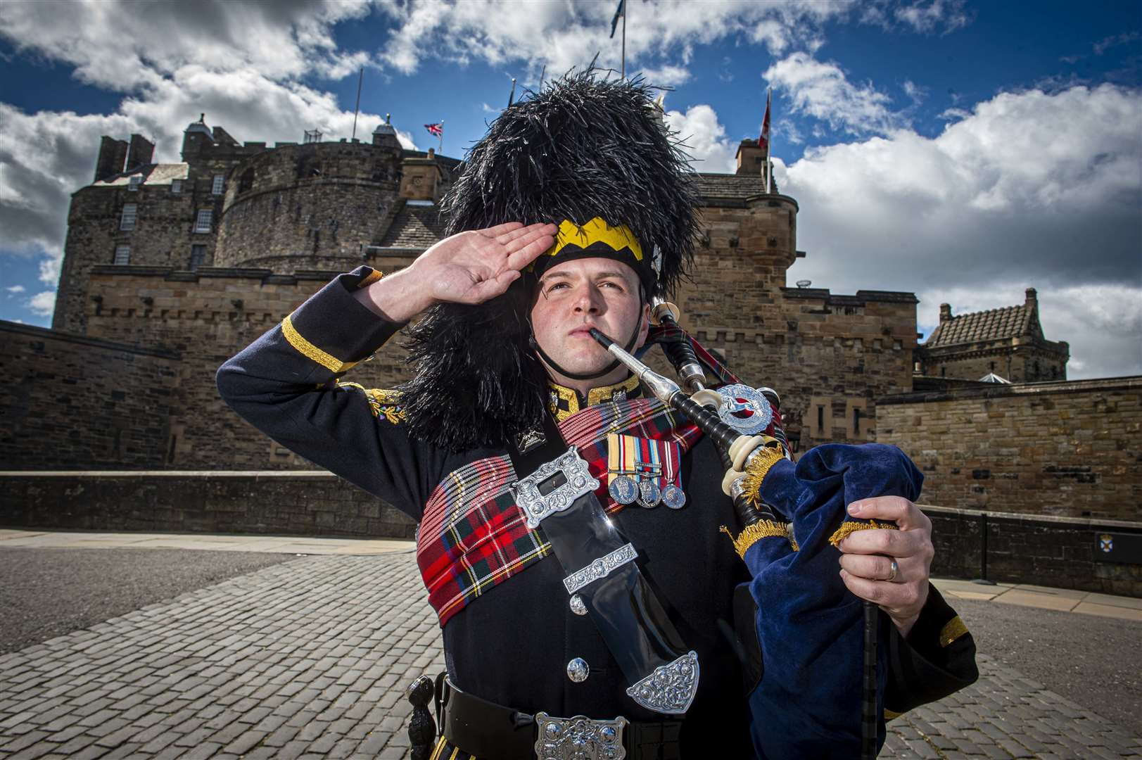 The first piper to sign up to the commemorations, Pipe Major Ben J Duncan, from The Royal Scots Dragoon Guards Pipes & Drums, who previewed the Heroes of St Valéry from the doorstep of Edinburgh Castle at the weekend. Credit: Mark Owens/Poppyscotland.