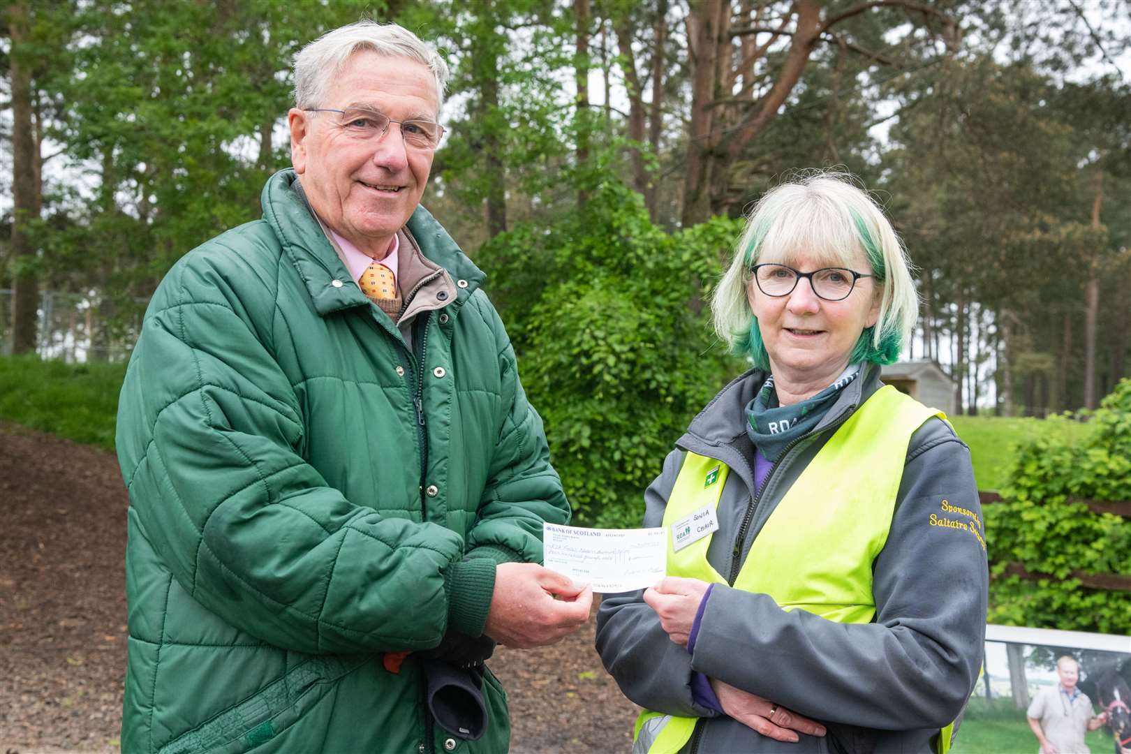 Varis Club president Michael Thompson hands the cheque over to RDA chairwoman Sonia Howell. Picture: Daniel Forsyth..