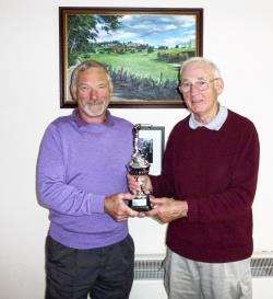 Winner of the Bandit Trophy Gordon Laing (left) receives his prize from Stewart Taylor