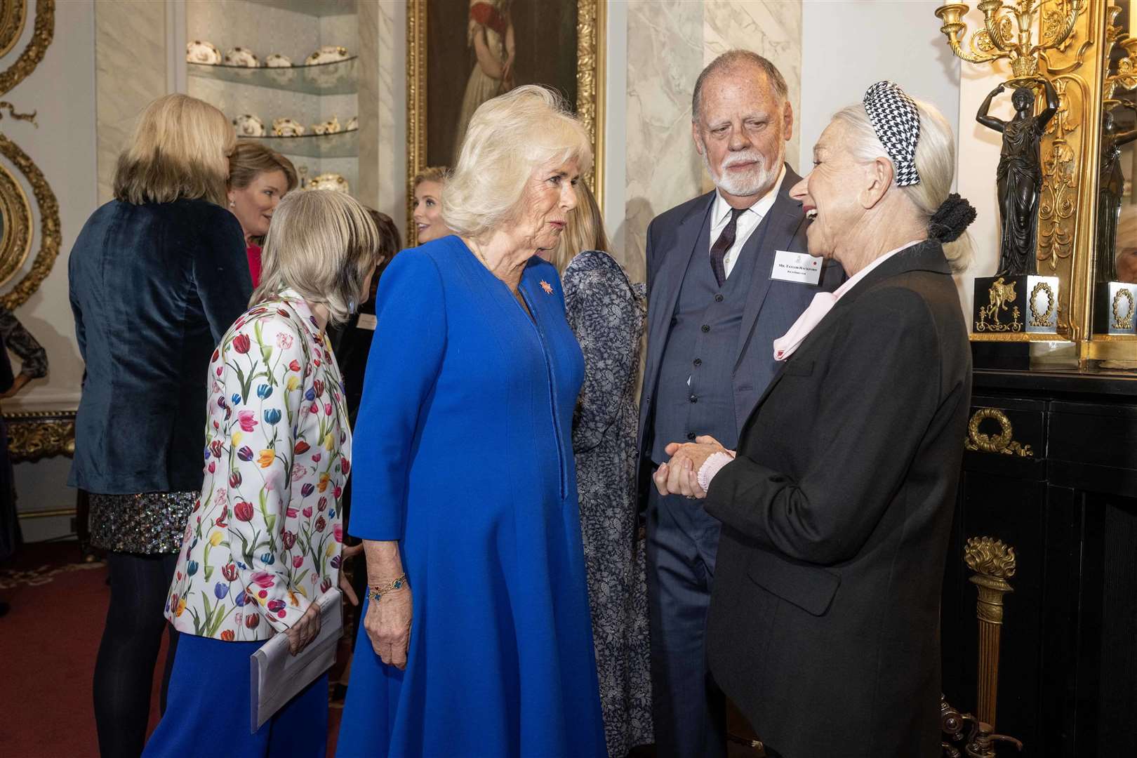 The Queen chats to Dame Helen Mirren and her husband director Taylor Hackford. Paul Grover/The Telegraph