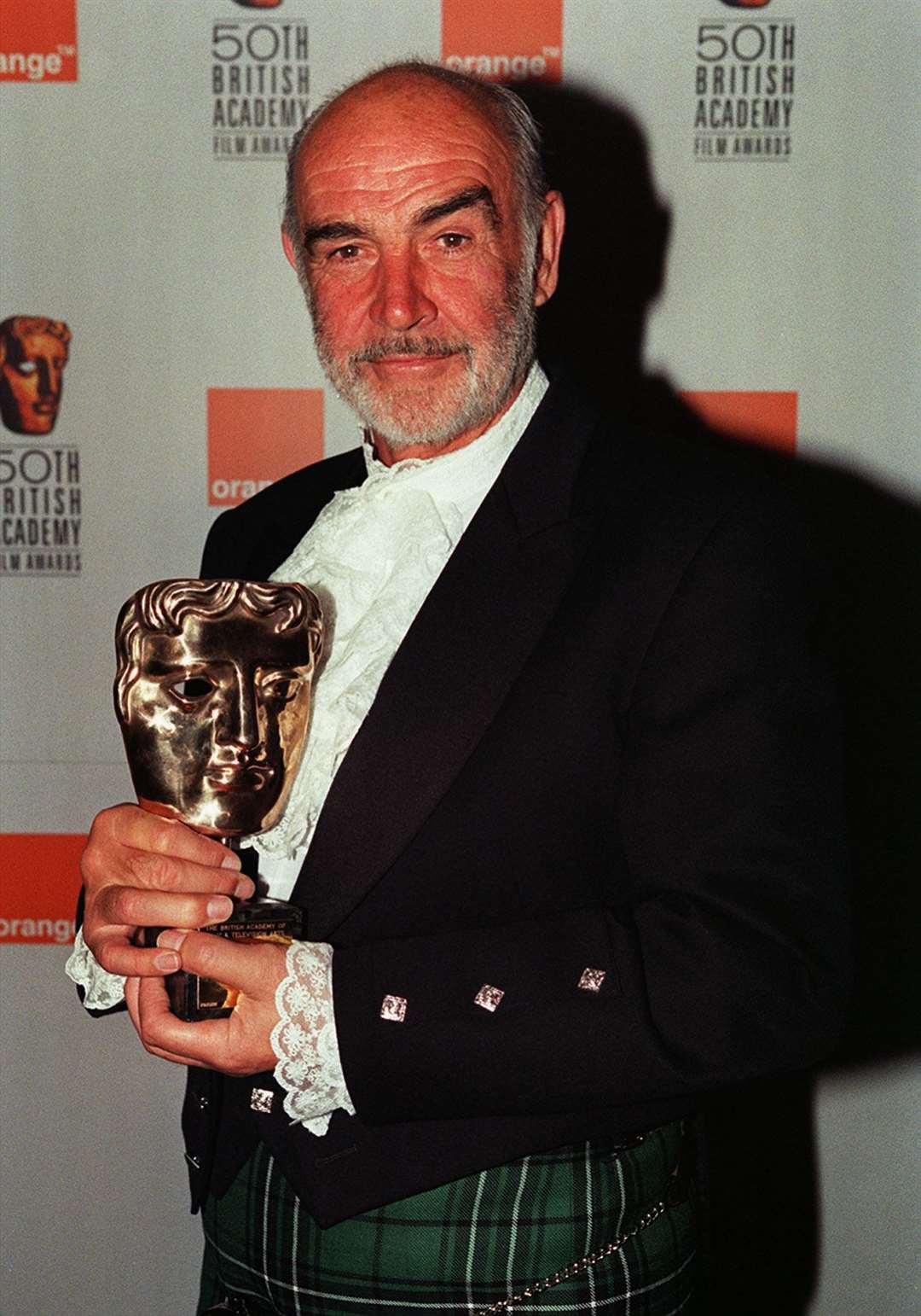 In this 1998 picture, Sir Sean poses with his Fellowship Award at the 50th Bafta Awards (PA)