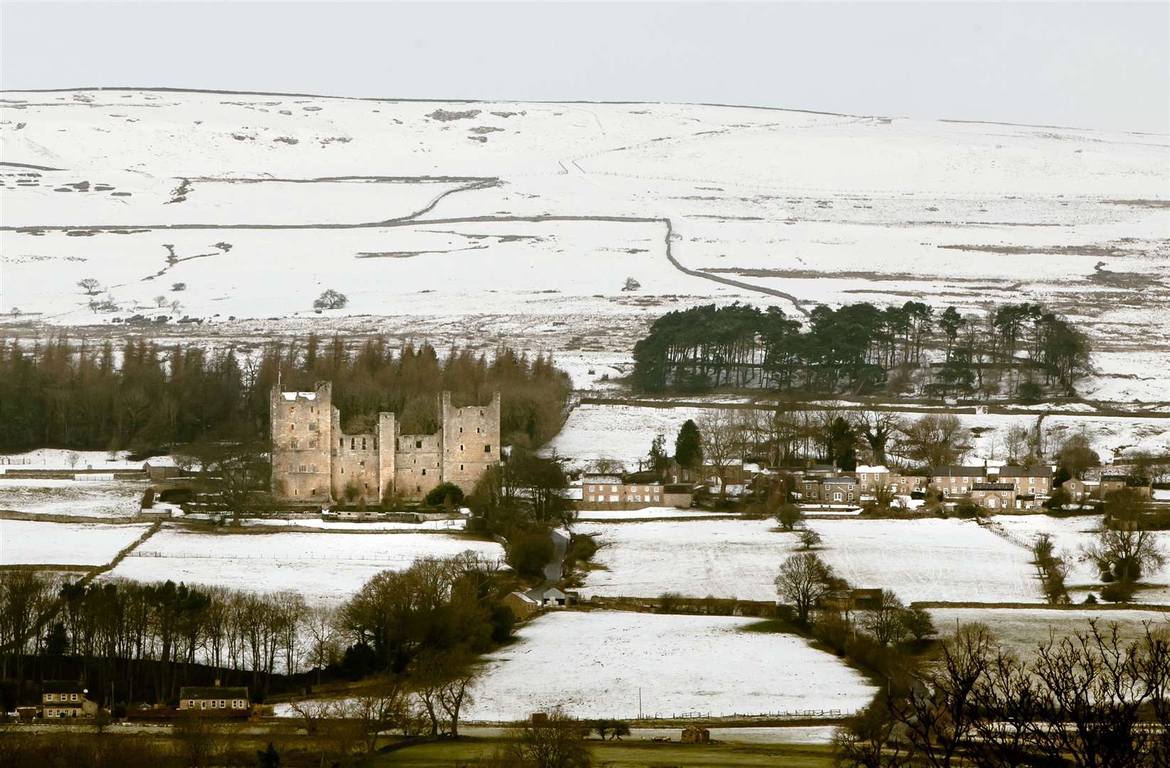 Castle Bolton is surrounded by snow in Leyburn, North Yorkshire (Danny Lawson/PA)