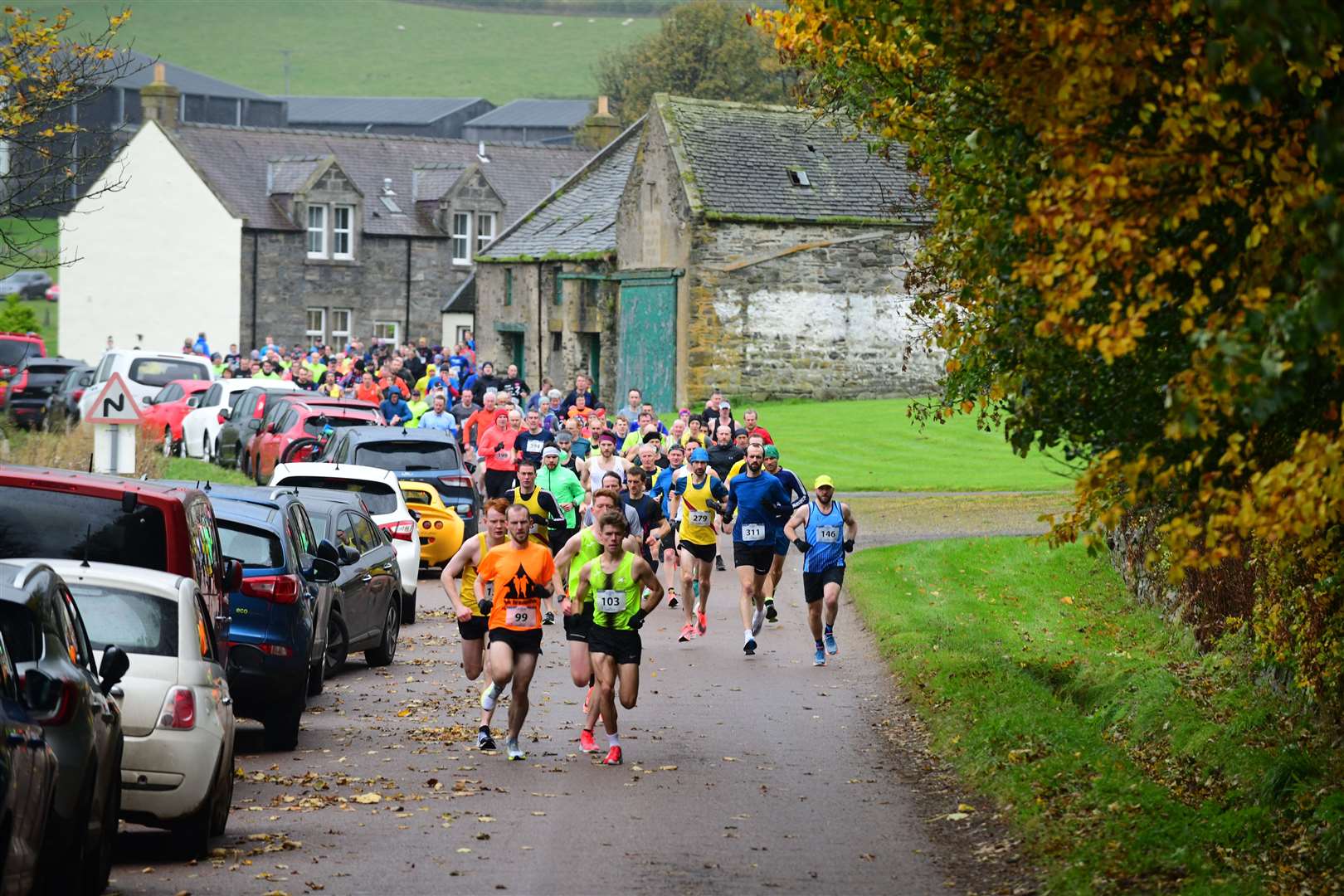 Runners head out from the distillery.