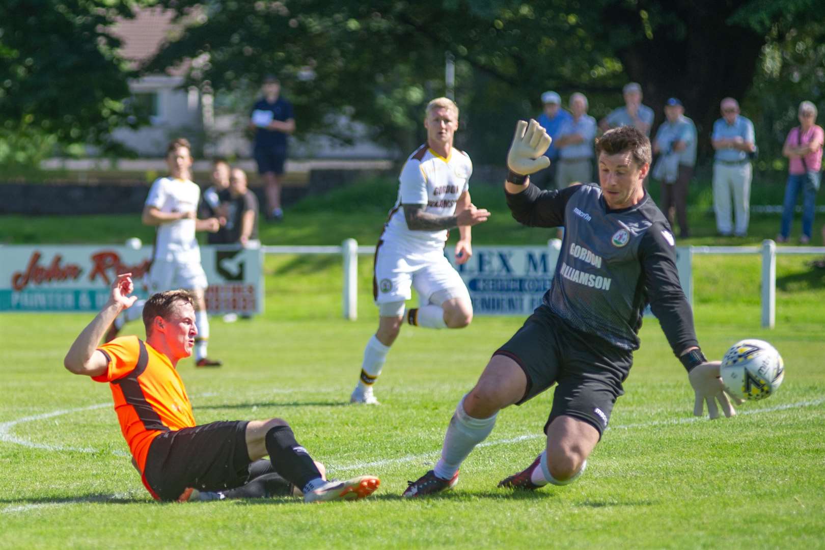 Rothes forward Steven Anderson forces a good save from Forres Mechanics' keeper Stuart Knight early in the match...Rothes FC (4) vs Forres Mechanics (1) - Mackessack Park, Rothes - Highland Football League 03/08/2019...Picture: Daniel Forsyth. Image No.044565.