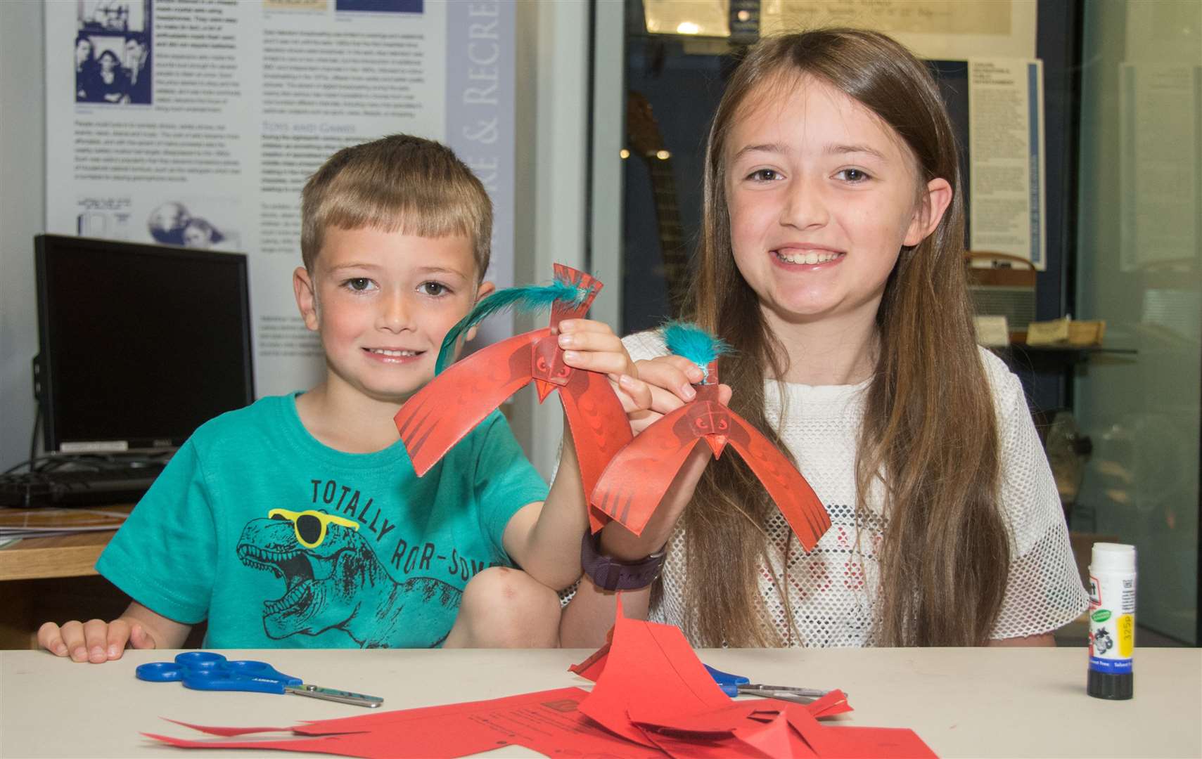 Oscar and Chloe Young show their balancing birds made at the Falconer Museum in Forres.