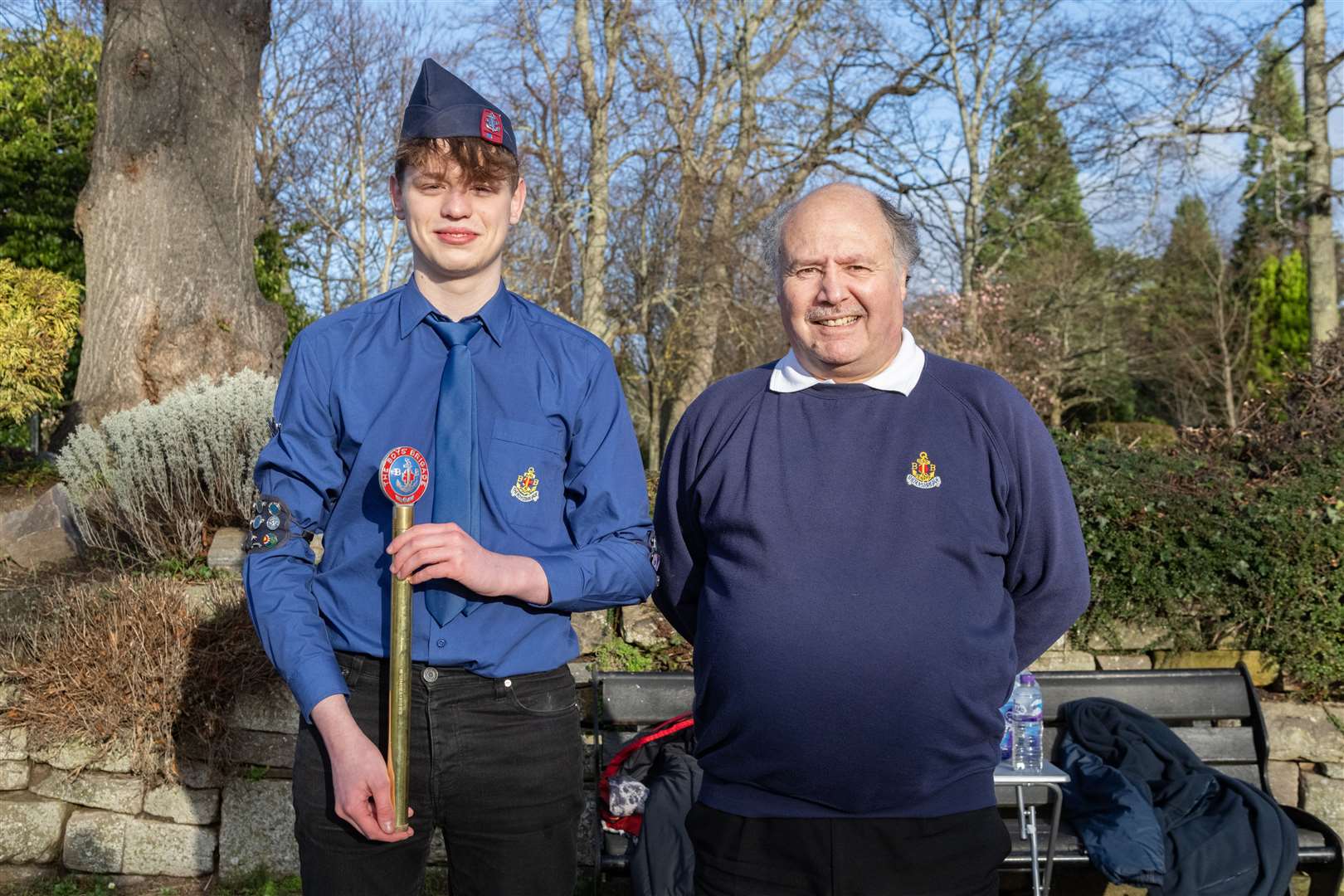 Callum Machray and Graeme Ferguson with the Kings Baton. Members of Forres Boys’ Brigade handing theKings Baton down from Nelson’s Tower to Grant Park.