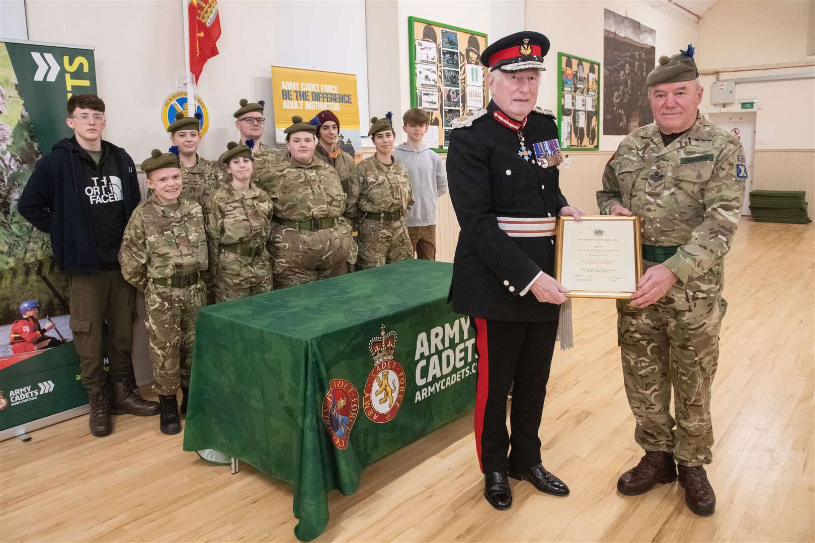 SSI Cowieson (right) is presented with a certificate of high appreciation for his meritorious service to the Army Cadet Force by Major General Monro. Picture: Daniel Forsyth..