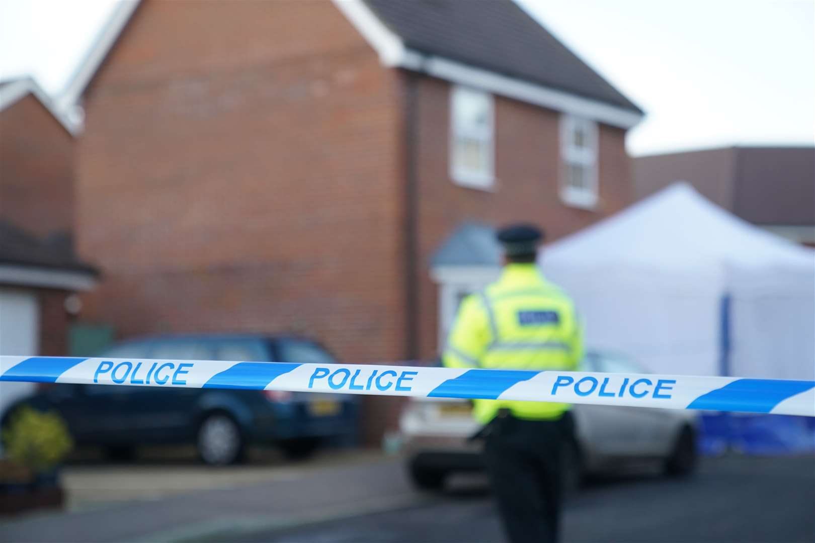 Police outside a house in Costessey near Norwich after four people were found dead inside the property (Joe Giddens/PA)