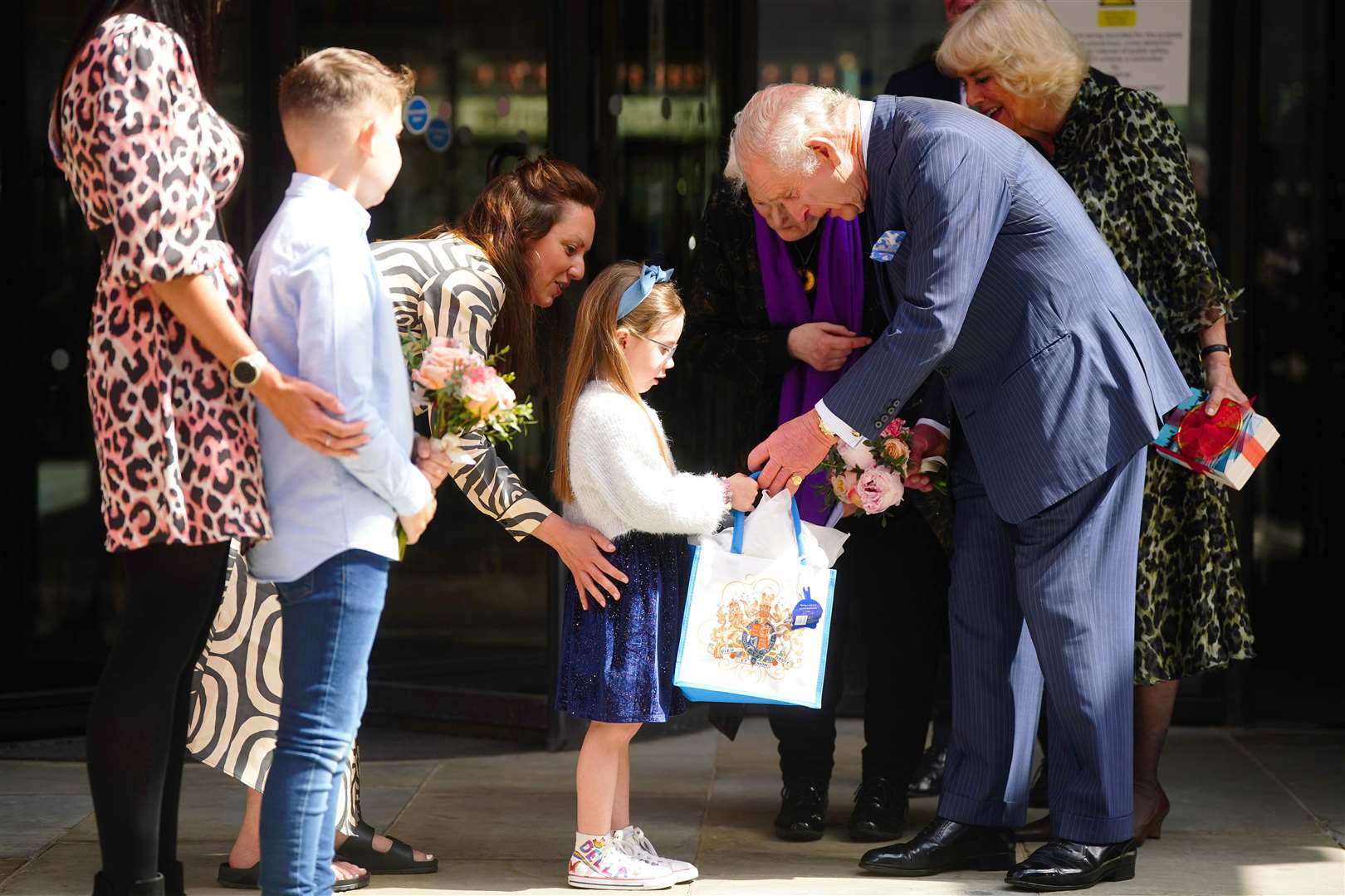 The King is presented with a bouquet as he leaves following a visit to University College Hospital Macmillan Cancer Centre in London (Victoria Jones/PA)[