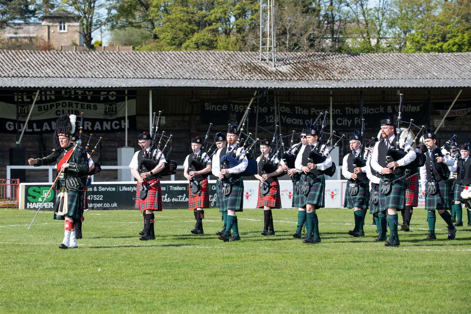 The Elgin and District and Forres Pipe Bands march together. Picture: Daniel Forsyth