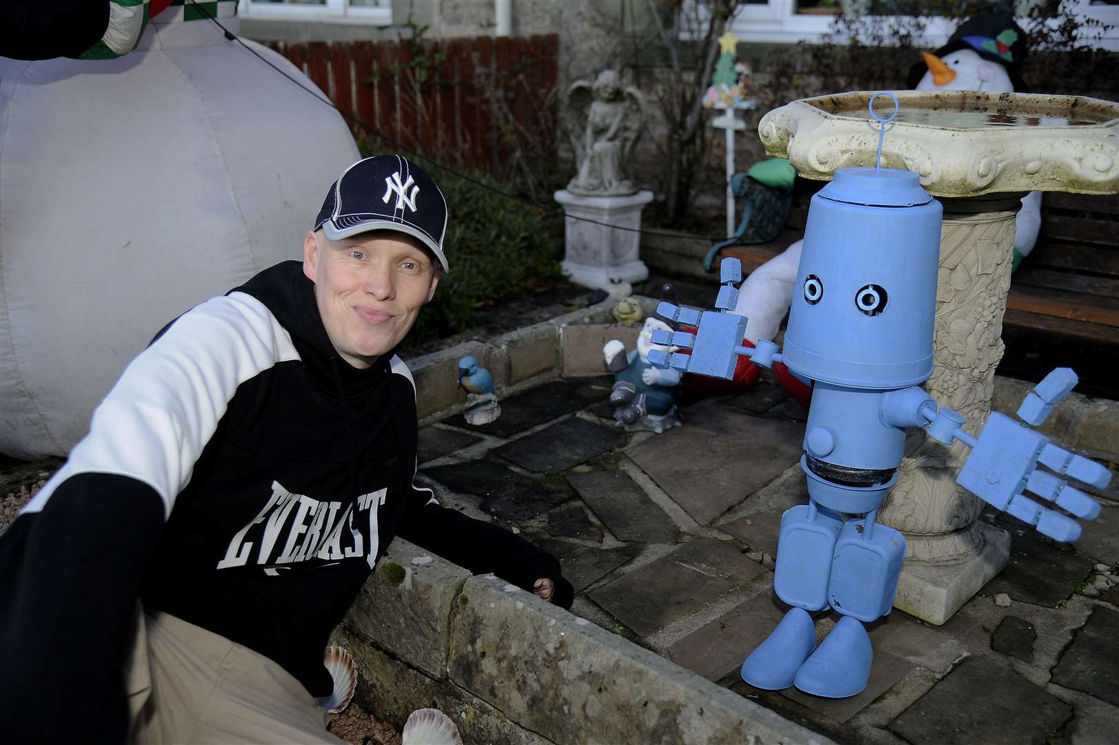 Mark with his new home-made robot. Picture: Becky Saunderson