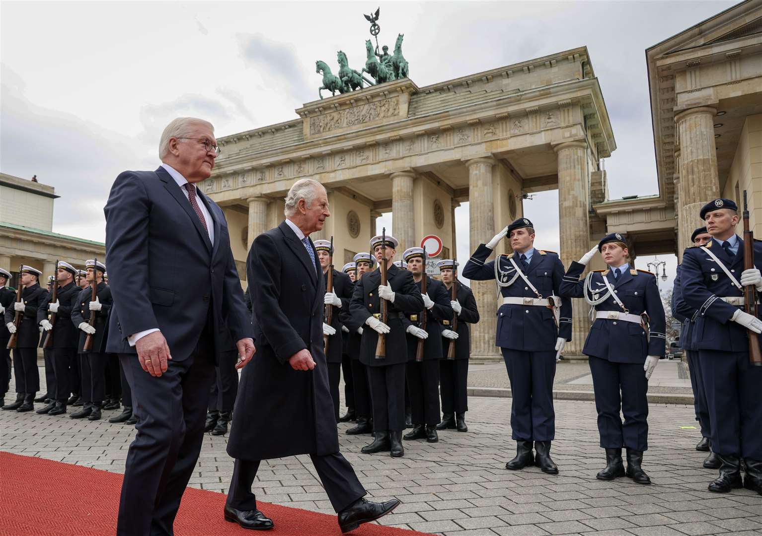 German President Frank-Walter Steinmeier (left) and the King inspect a guard of honour during the ceremonial welcome at the Brandenburg Gate, Berlin (Adrian Dennis/PA)