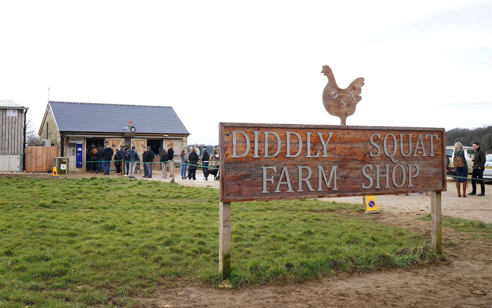 Customers queue for Jeremy Clarkson’s Diddly Squat Farm Shop near Chadlington in Oxfordshire during the opening weekend of the shop following its winter closure in February 2023 (Gareth Fuller/PA).