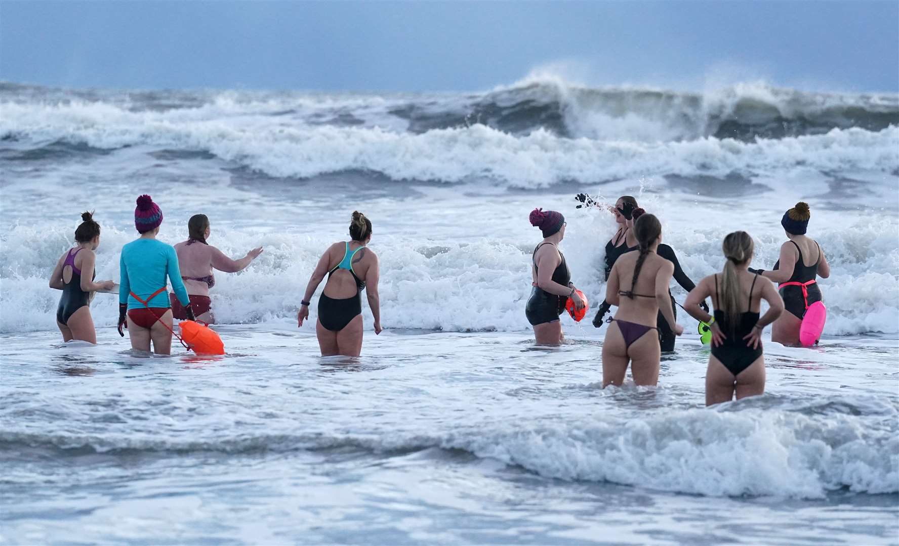 Women swimmers brave freezing conditions as they gather to celebrate International Women’s Day at King Edward’s Bay, near Tynemouth (Owen Humphreys/PA)