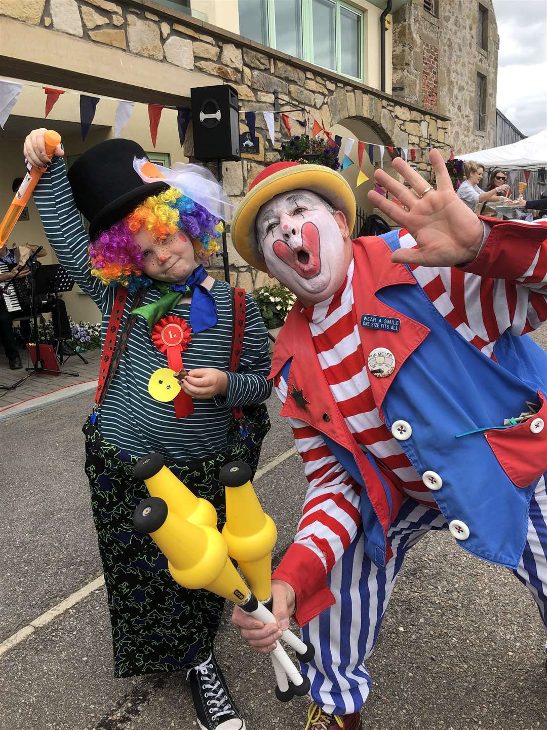 Bubbles the Clown with Zoe, winner of the children's fancy dress parade at the last Findhorn fair in 2019.