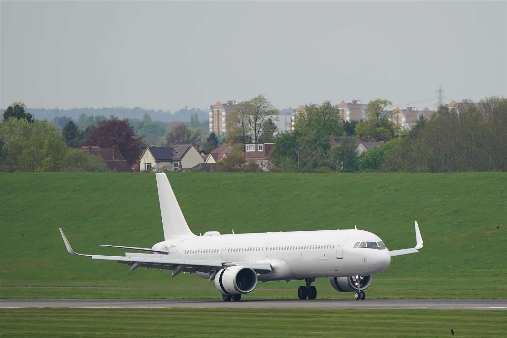 A plane with people evacuated from Sudan via Cyprus touches down at Birmingham airport on Tuesday (Joe Giddens/PA)