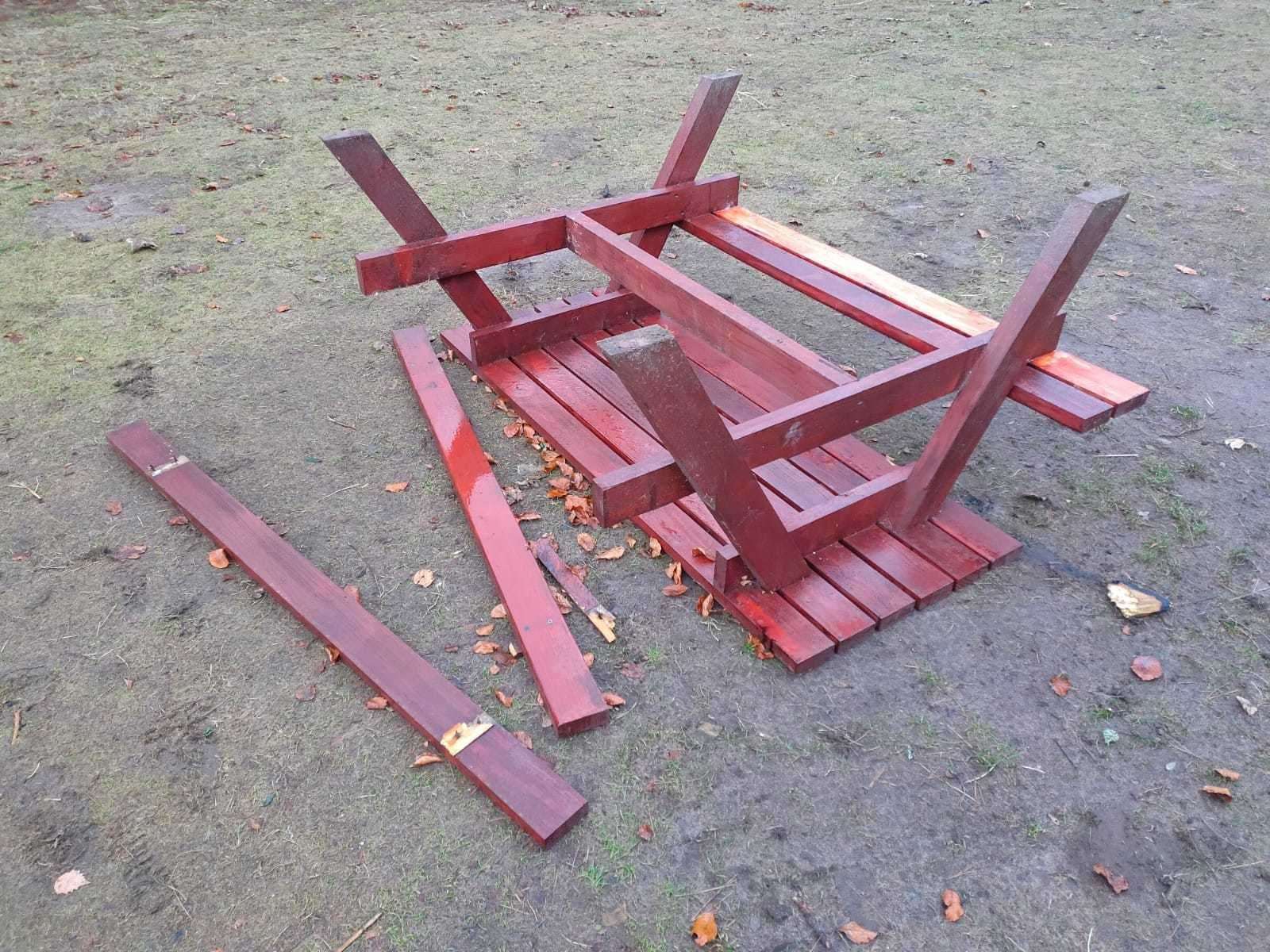 A picnic table was overturned and smashed.