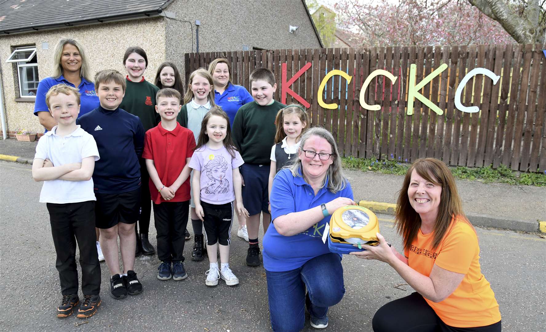 Claire Brenton from Kinloss Crafty Cool Kids Club holds their new defibrillator with Sandra McKandie. Picture: Becky Saunderson