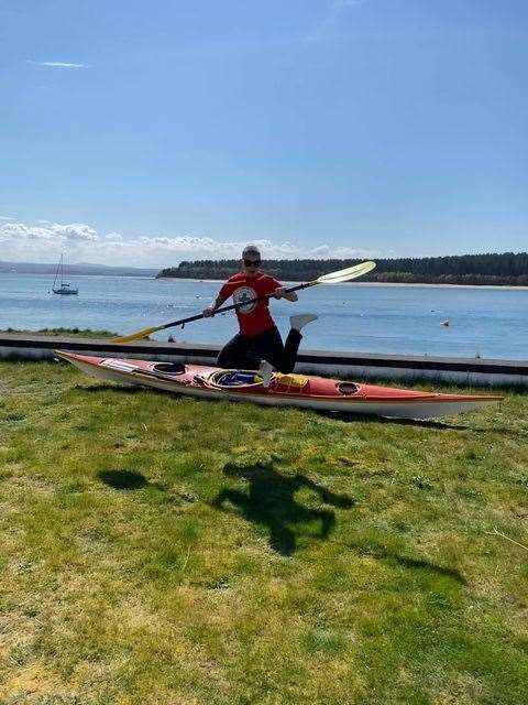 Ami getting a feel for her kayaking equipment at Findhorn Bay.