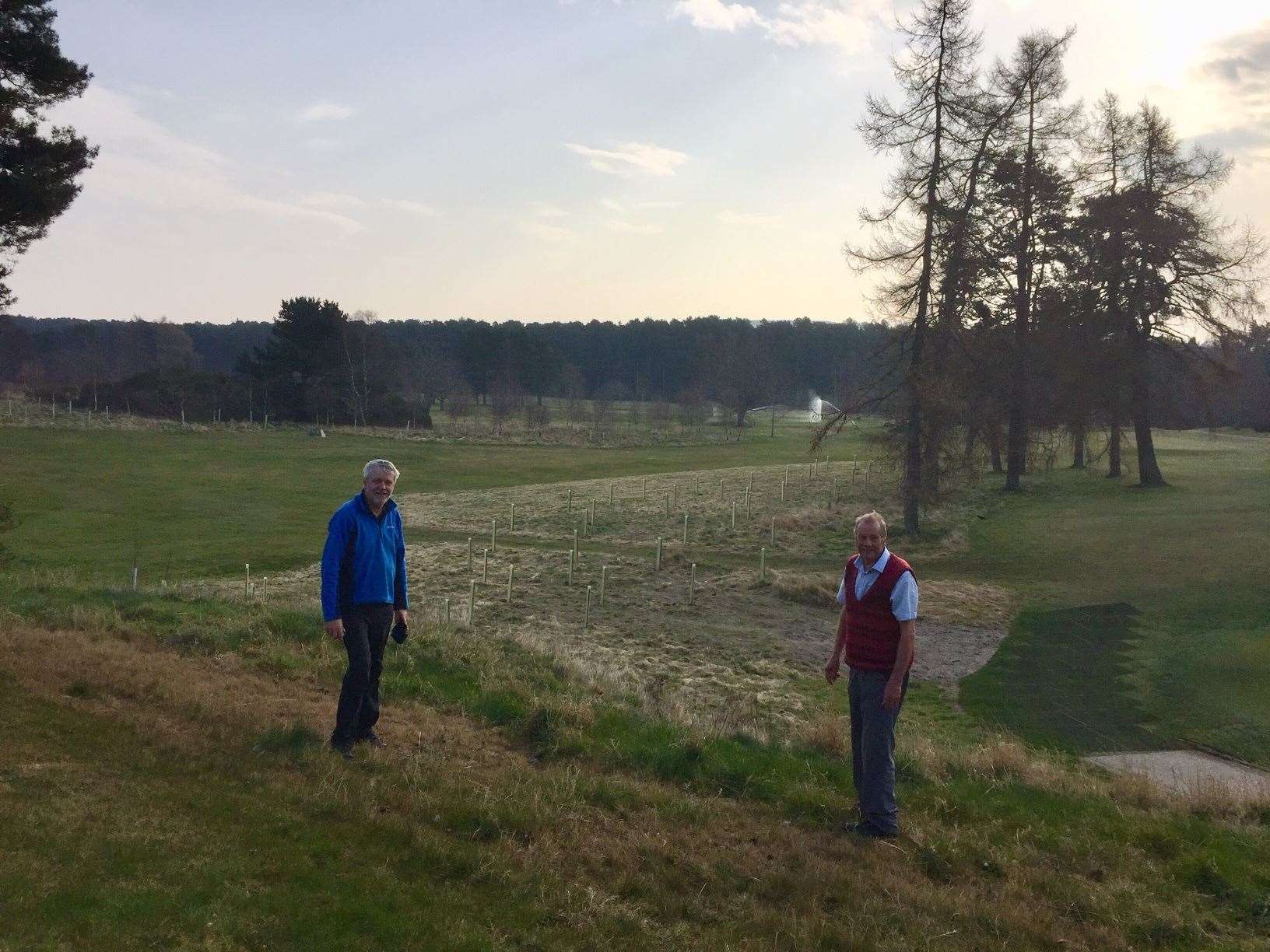 Forres Rotary vice president Brian Higgs and Dr Stan Thompson planting trees on Forres Golf Course.