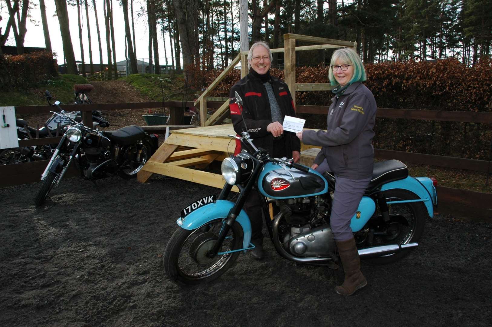 A cheque for £100 presented to Sonia Howell by (either) Highland Classic Motorcycle Club secretary Malcolm Davidson. Picture by Neil Ellison.