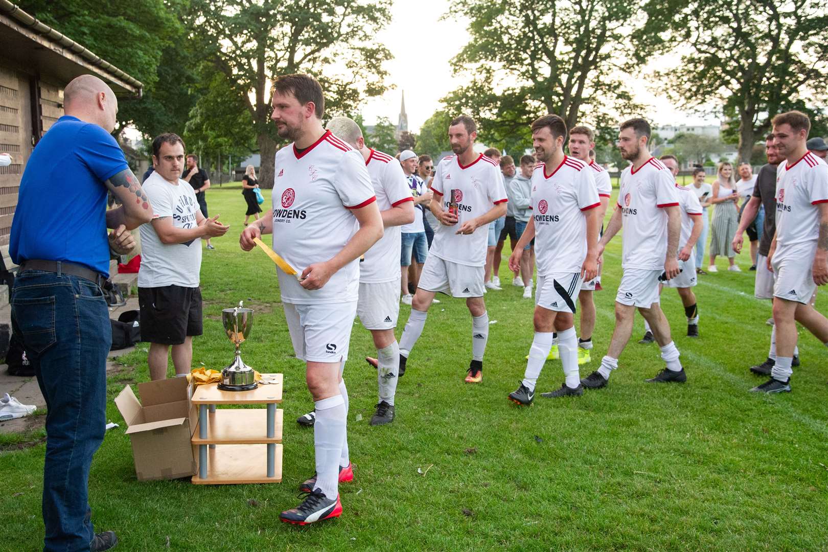 Carisbrooke's Chris Ross leads the celebrations for the Forres side...Carisbrooke FC (1) vs Westerlea FC (0) - Top Car Cup Final - Roysvale, Forres 16/07/2021...Picture: Daniel Forsyth..