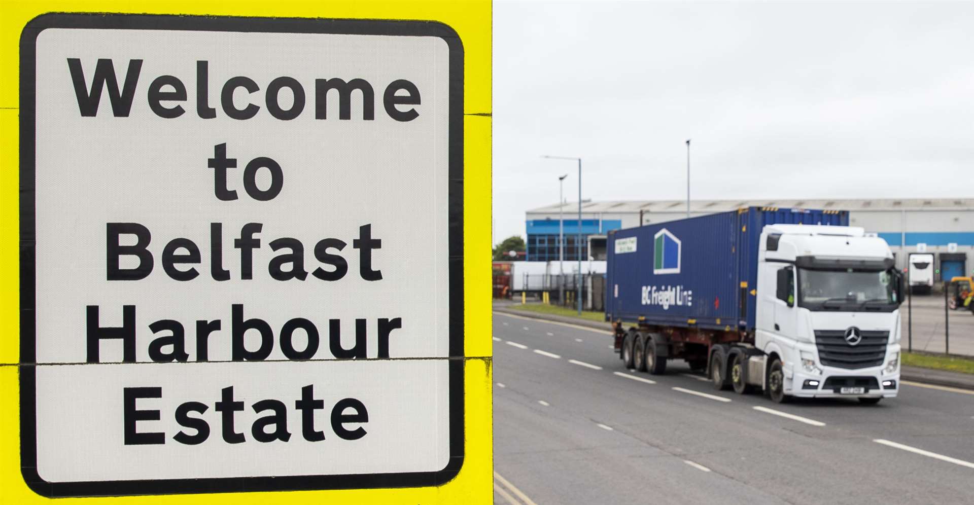 A haulage lorry drives past a sign at Belfast Port (Liam McBurney/PA)