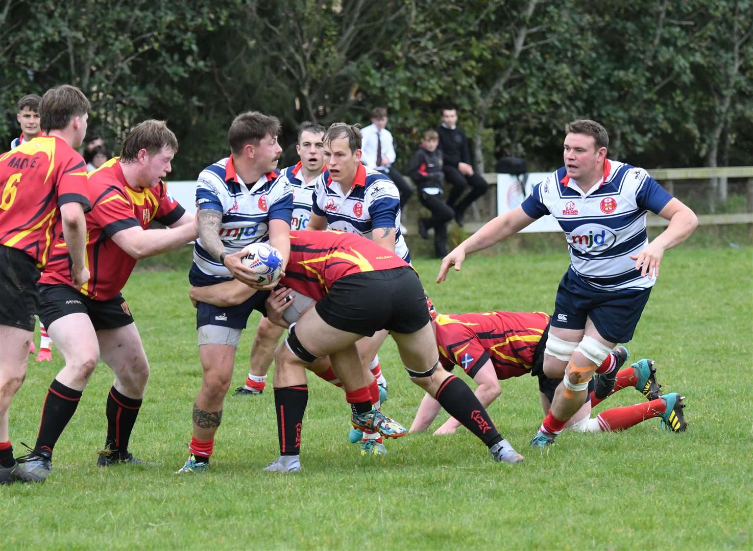 Connor McWilliam offloads in the tackle to Steven Clark. Photo: James Officer
