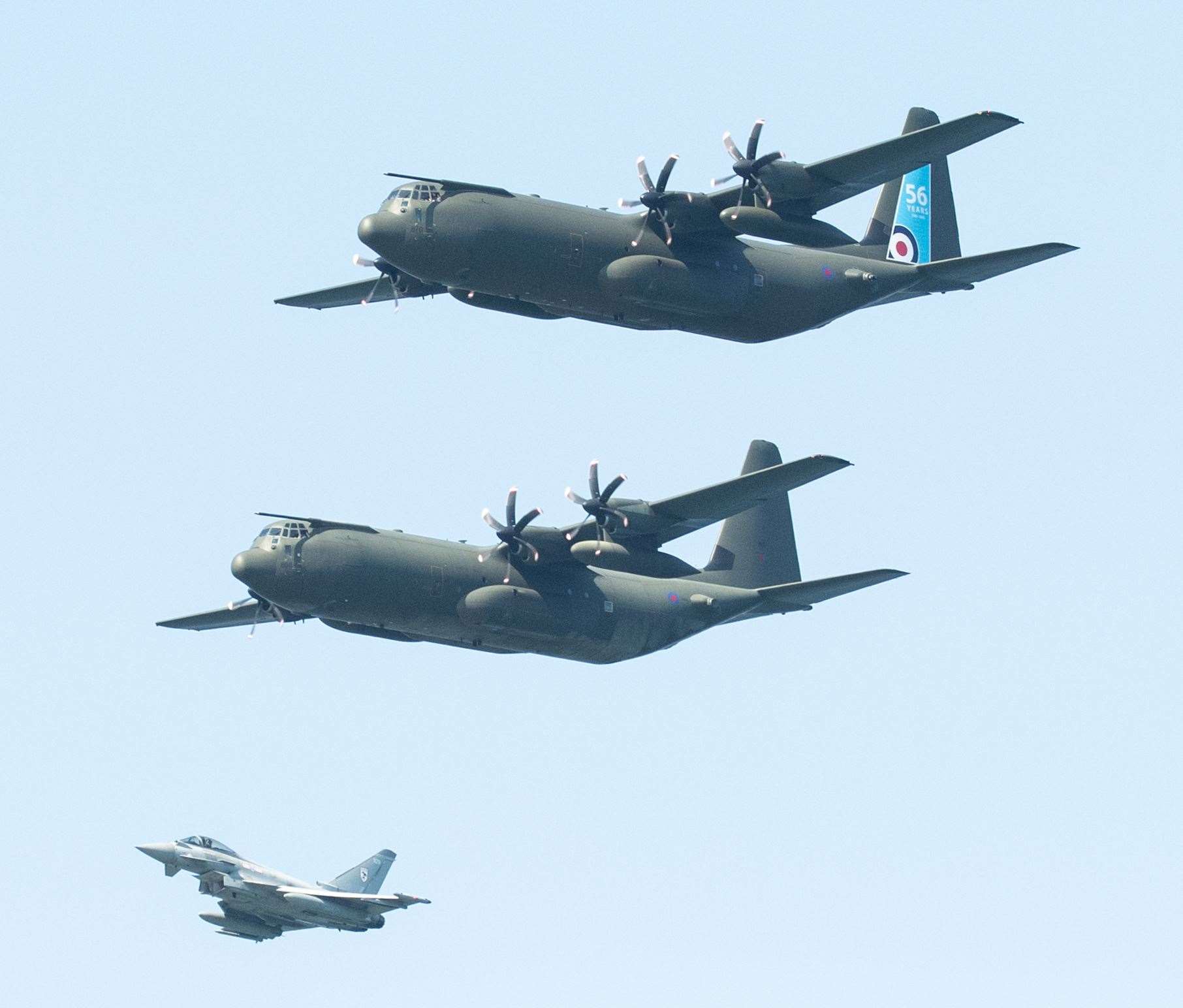 The imminent retirement of the Hercules from the RAF is marked by a flypast which went over RAF Lossiemouth. The three Hercules' were flanked by two Typhoons...Picture: Daniel Forsyth..