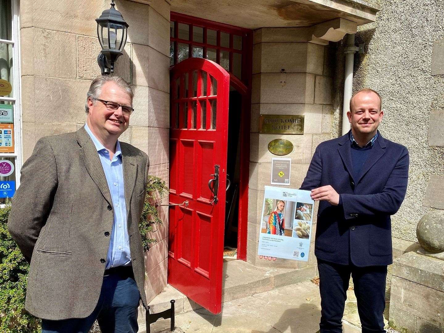 Knockomie Inn owner Gavin Ellis (left) and Stewart Marshall, of Johnstons of Elgin, at the Forres inn with one of the prototype posters.