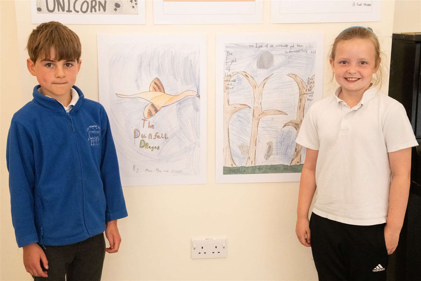 Logie Primary School pupils Max Laing and Ami-Leigh Shevill with adverts for their animation. Picture: Daniel Forsyth