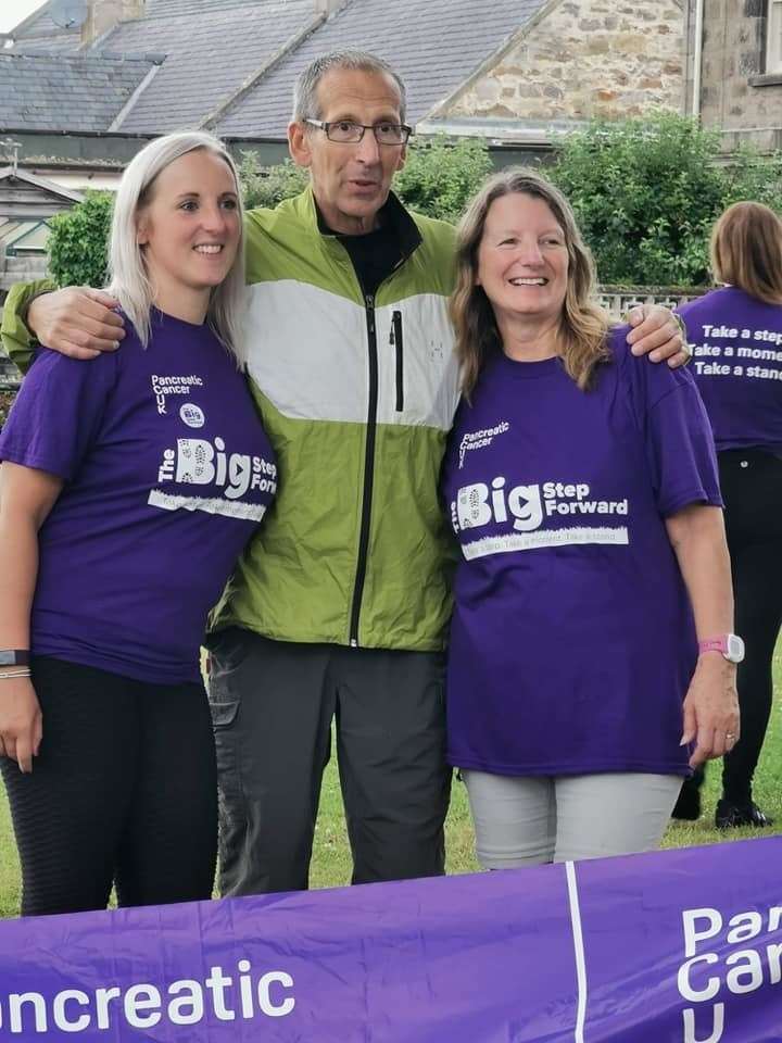 The woman at the finishing post with Alistair Stewart, who was diagnosed with pancreatic cancer in April 2019.