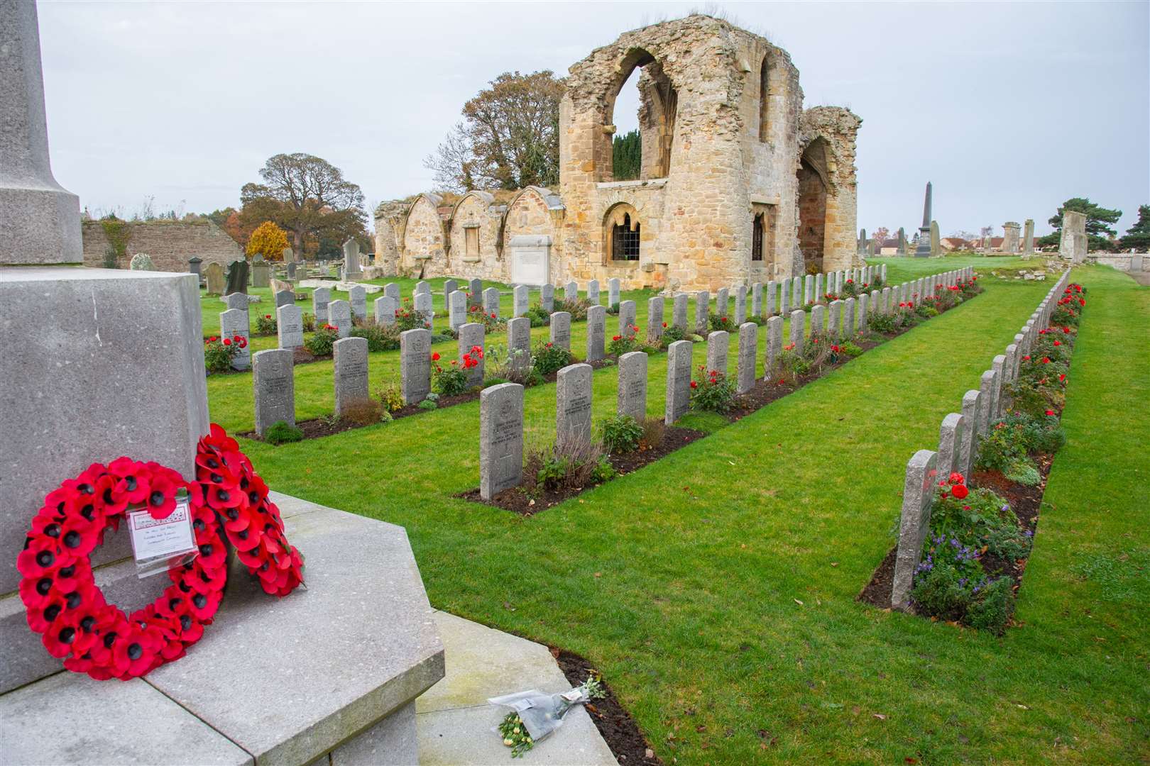 Wreaths and flowers are laid at the war memorial near the Commonwealth War Graves at Kinloss Abbey...Remembrance Sunday 2020...Picture: Daniel Forsyth..