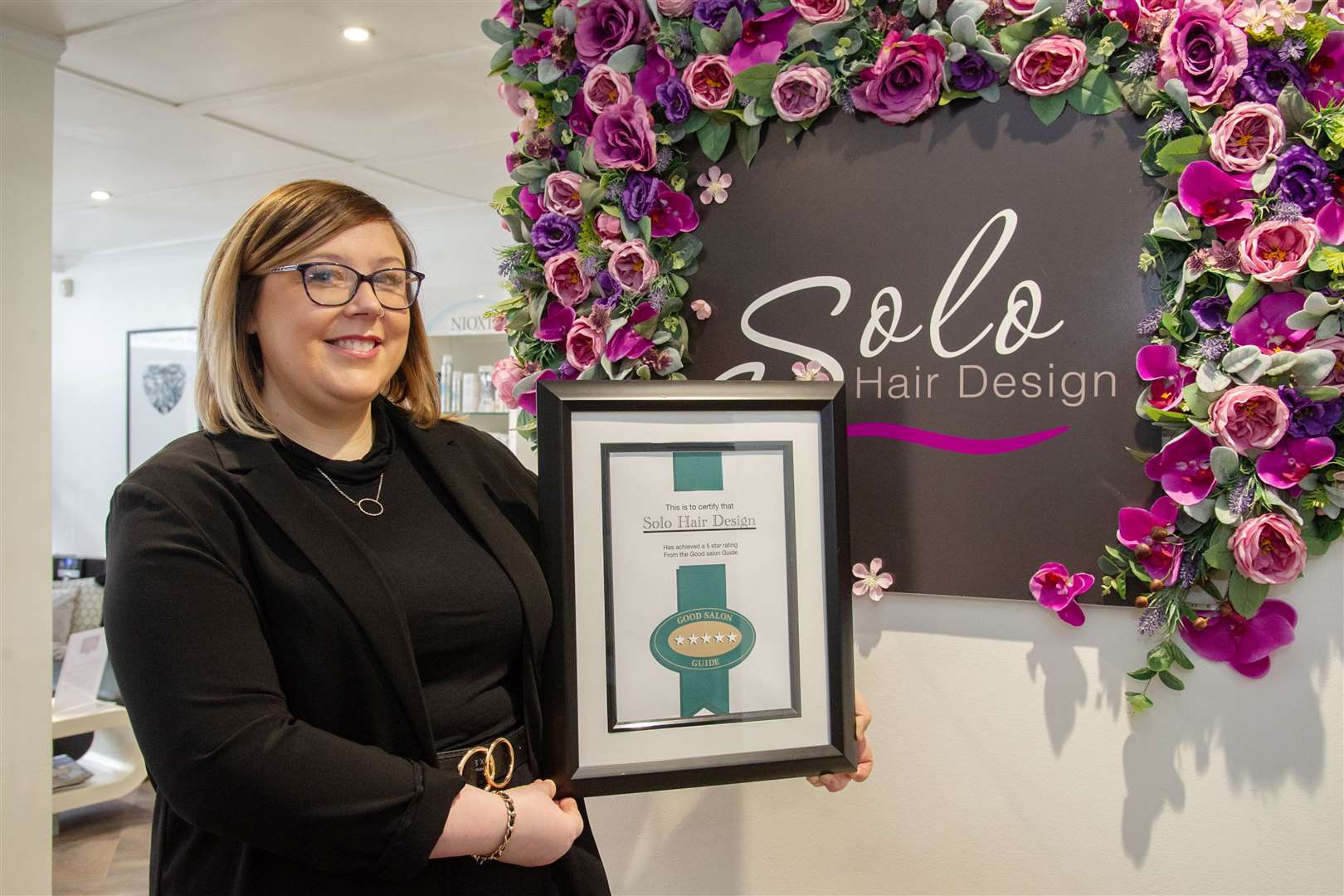 Lisa Lawrence showing off Solo Hair Design's five star rating, as the business marks its 10th anniversary..Picture: Daniel Forsyth..