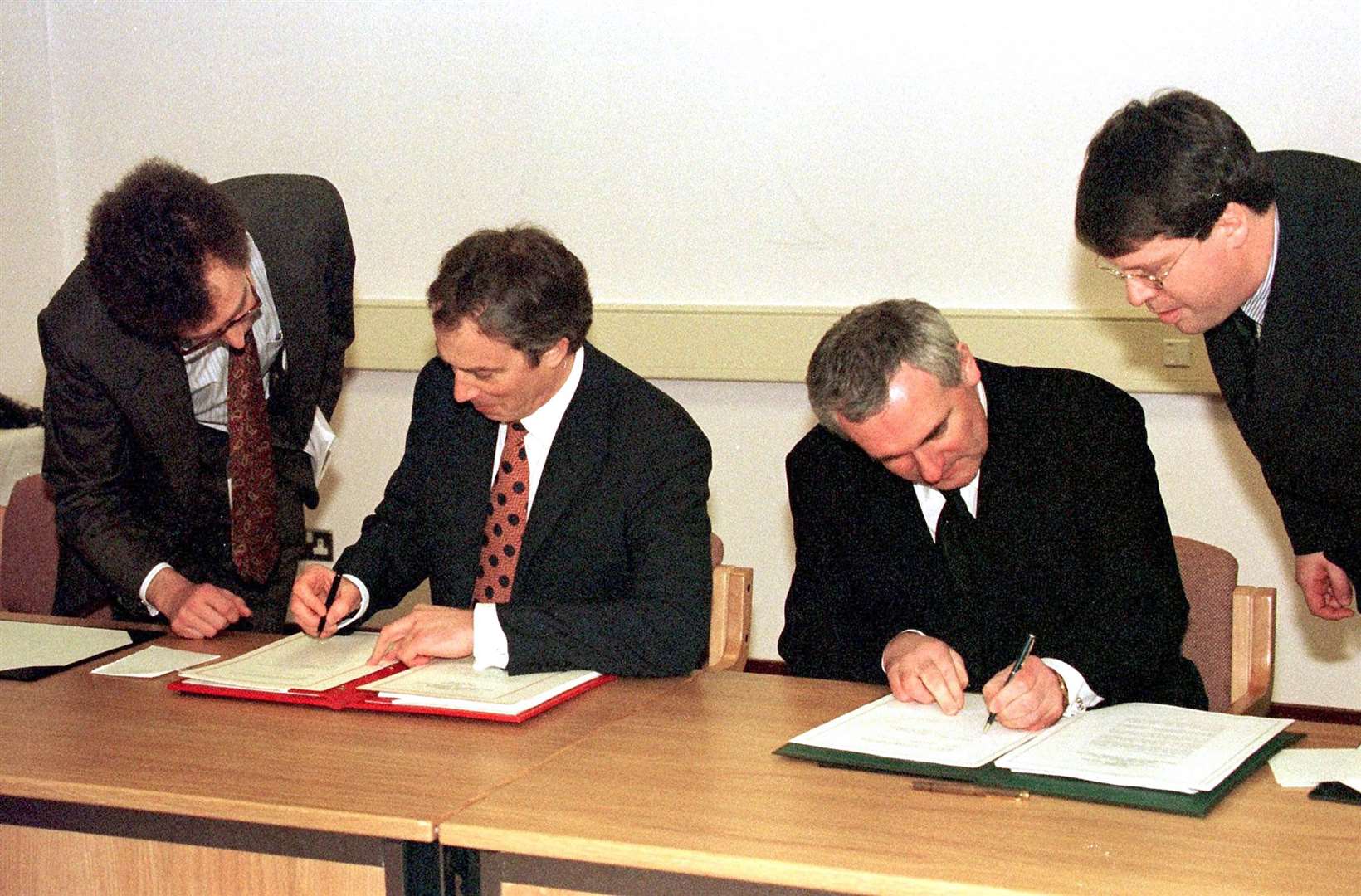 Tony Blair and Bertie Ahern signing the historic Good Friday peace agreement in 1998 (John Giles/PA)