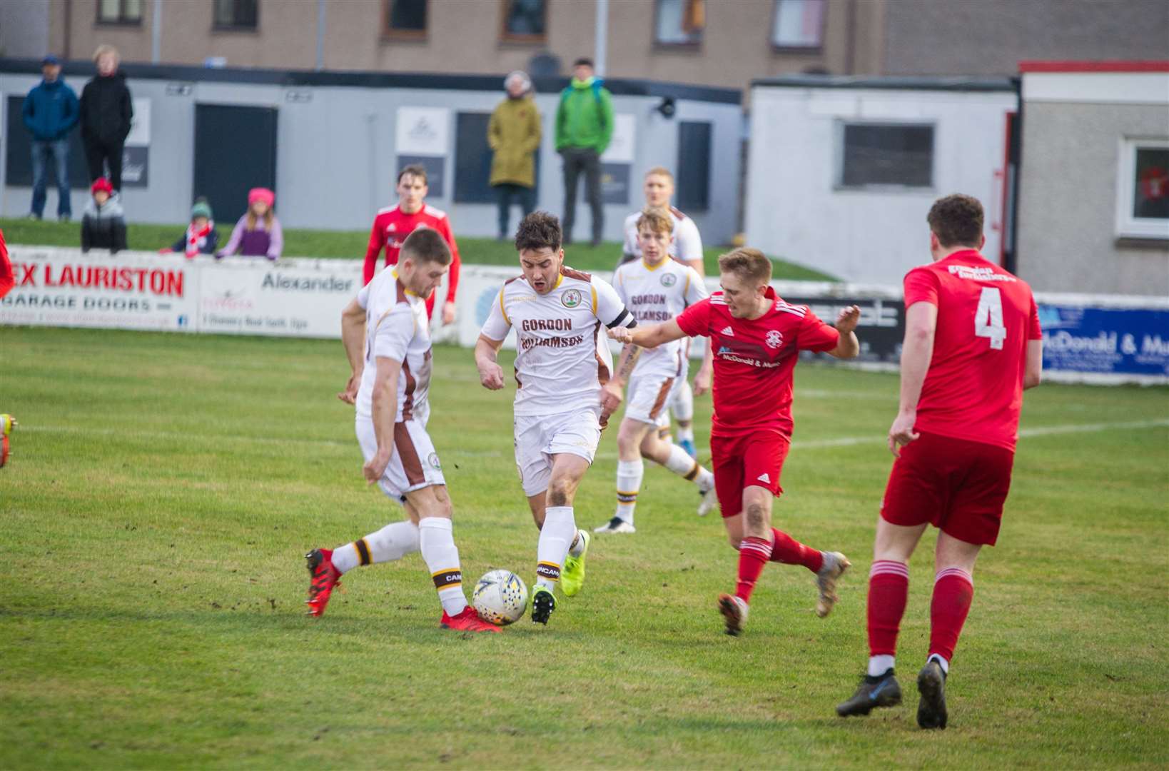 Forres Mechanics captain Martin Groat (centre) stepping onto the ball Picture: Becky Saunderson