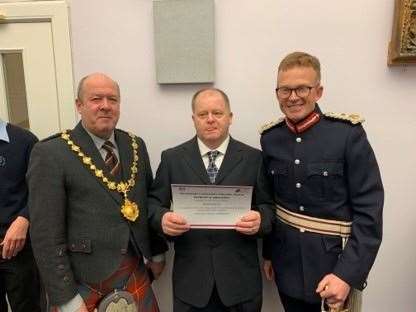 Provost of Nairn Laurie Fraser (left) and Lord-Lieutenant for Nairnshire George Asher presented a certificate to Mr David Nicol marking his service to the community and, in particular, his participation in the Nairn befriending scheme.