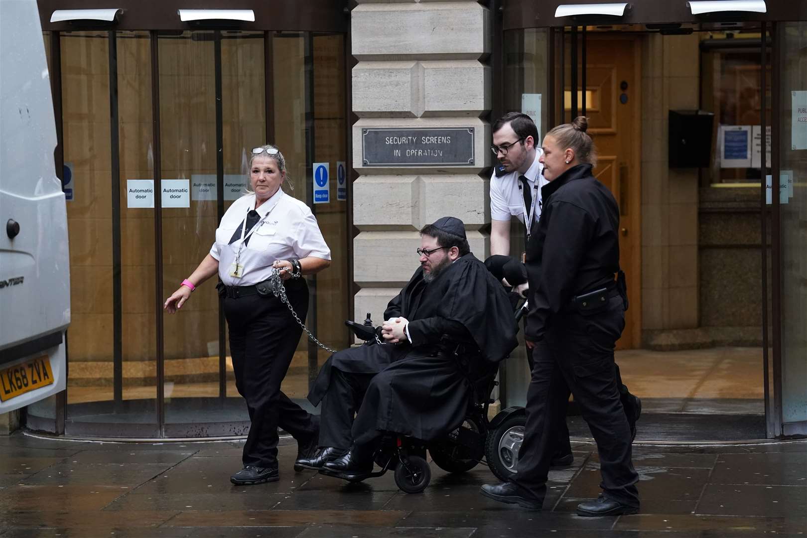 Nicholas Rossi leaves Edinburgh Sheriff Court after his extradition hearing (Andrew Milligan/PA)