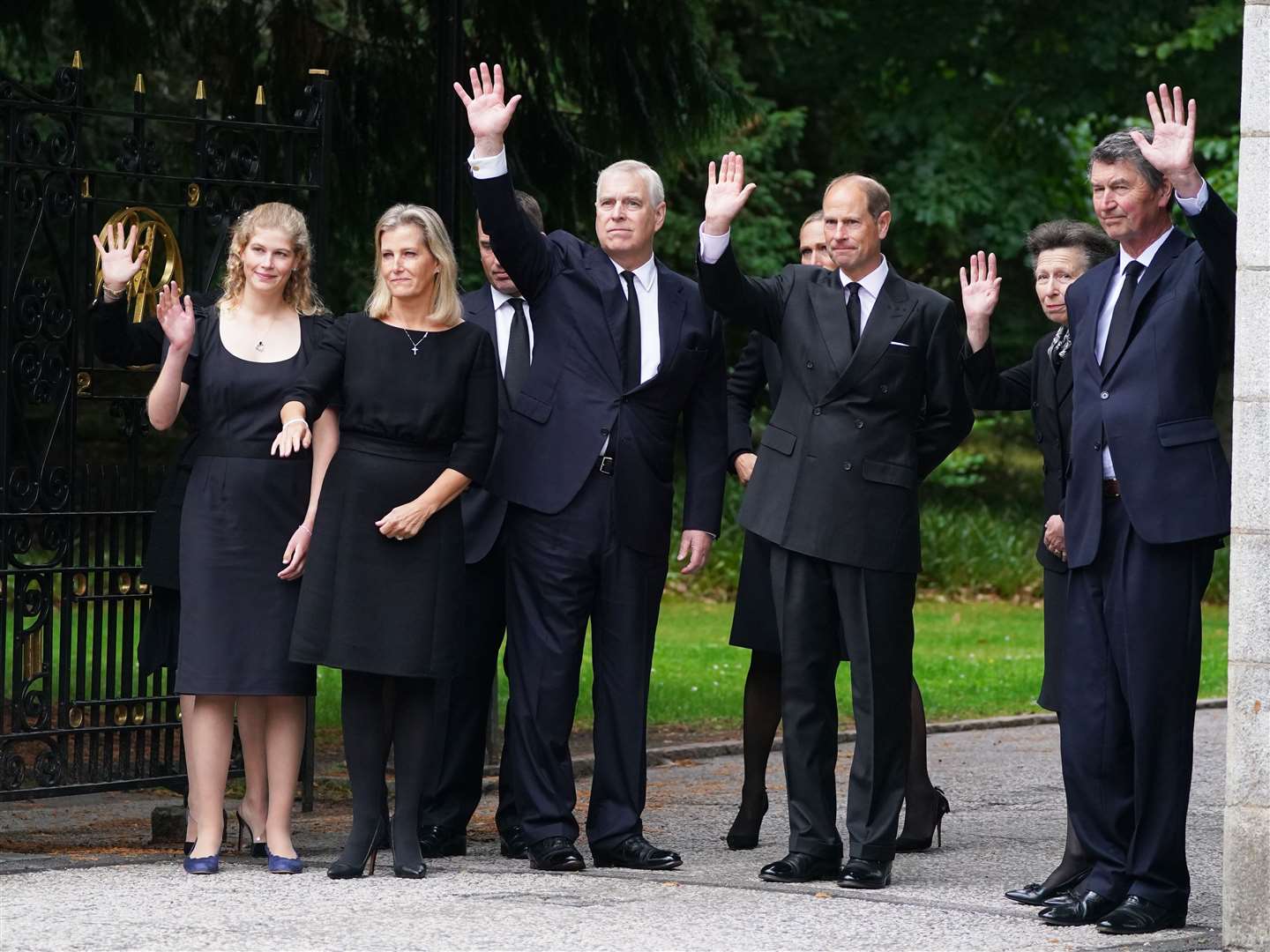 (Left-right) Lady Louise Windsor, the Countess of Wessex, Peter Phillips (hidden), the Duke of York, Zara Tindall (hidden), the Earl of Wessex, the Princess Royal and Vice Admiral Timothy Laurence wave to well-wishers outside Balmoral (Owen Humphreys/PA)