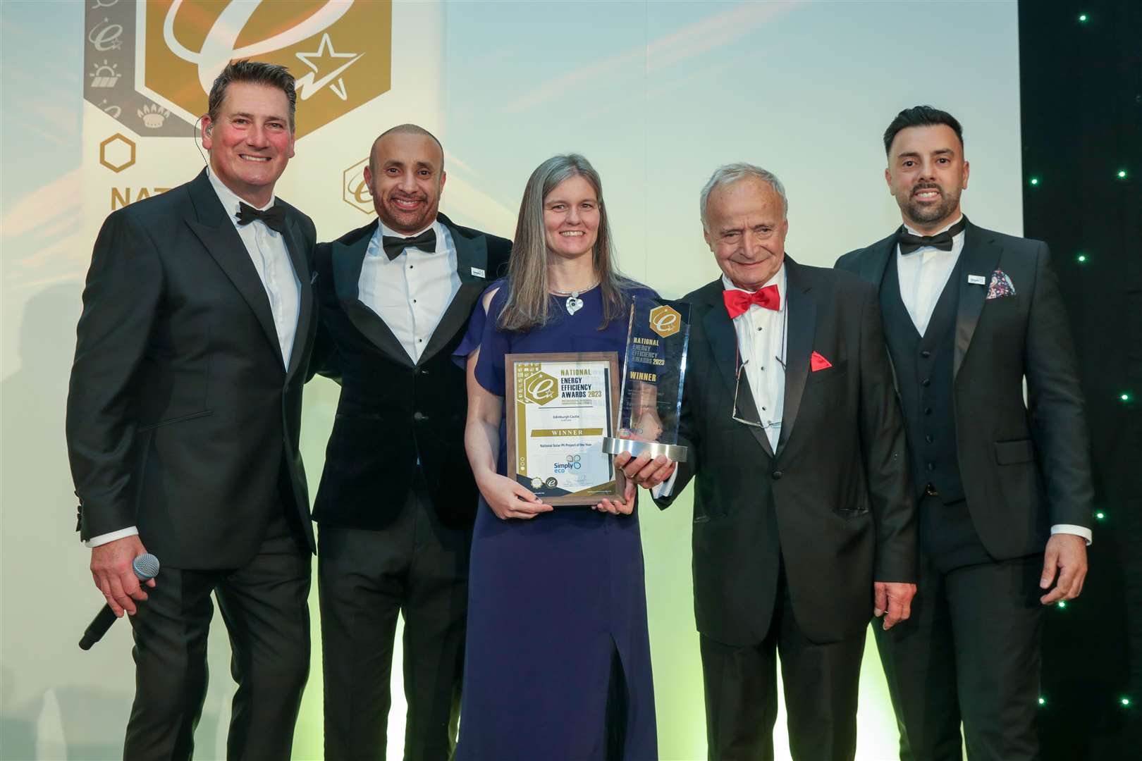AES Solar’s finance director Lynn Davidson and managing director George Goudsmit are presented the award by representatives from the award sponsors, Simply Eco, and Tony Hadley MBE.