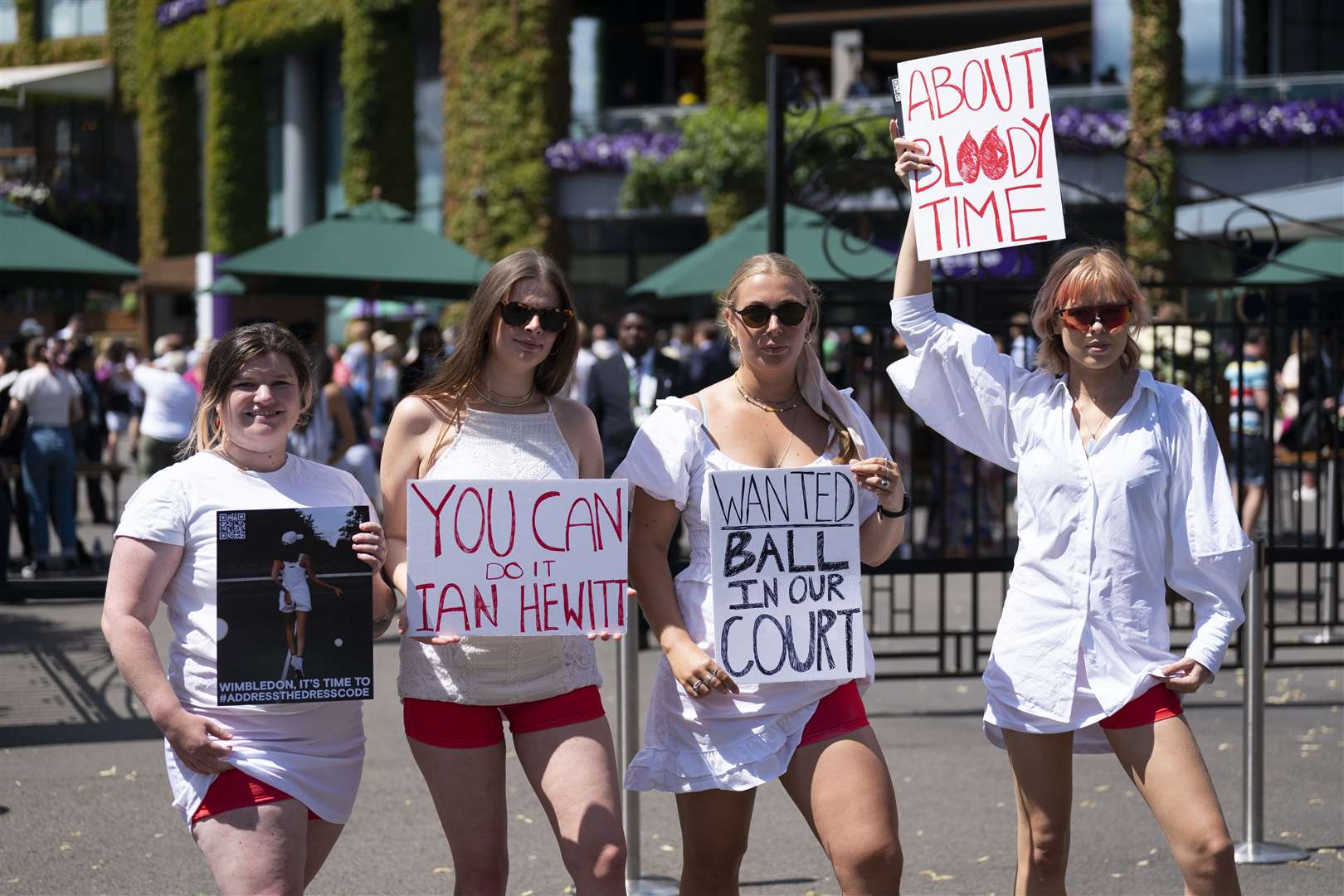 Campaigners from Address The Dress Code outside the main gate at Wimbledon (Kirsty O’Connor/PA)