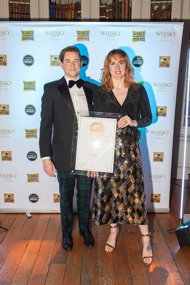 John Robertson and Jennifer Robertson with their award.