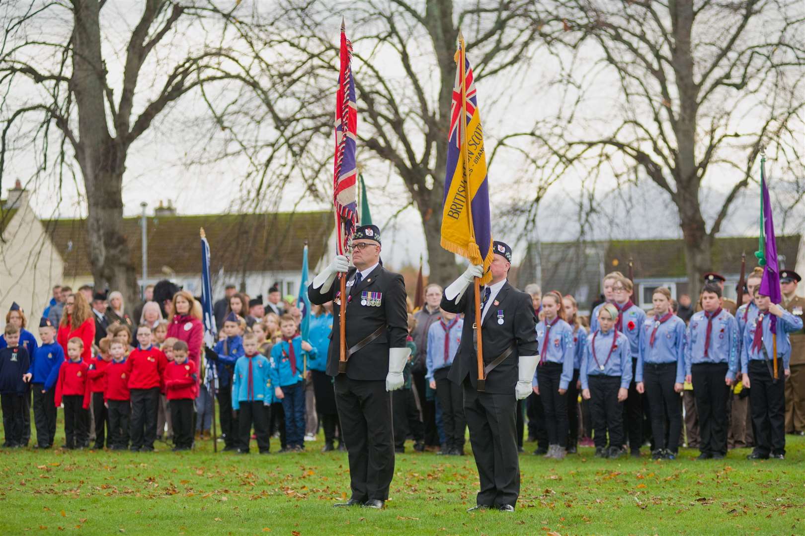 Standard Bearers standing to attention at Market Green during 2018's service.