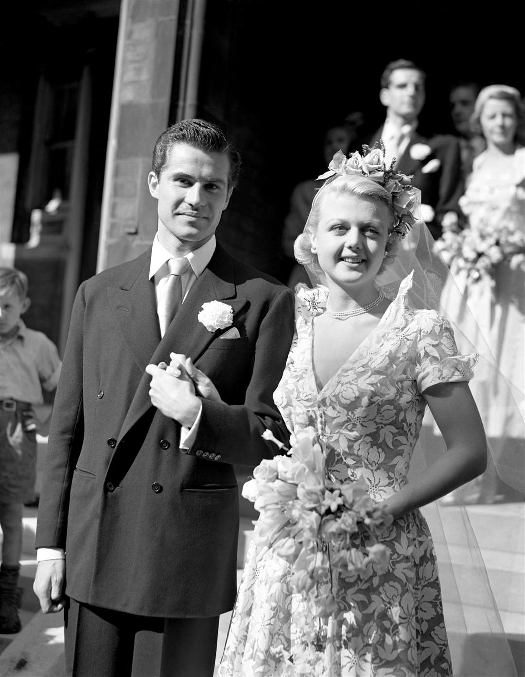 Dame Angela Lansbury with her husband Peter Shaw after their wedding at St Columba’s Church, London (PA)