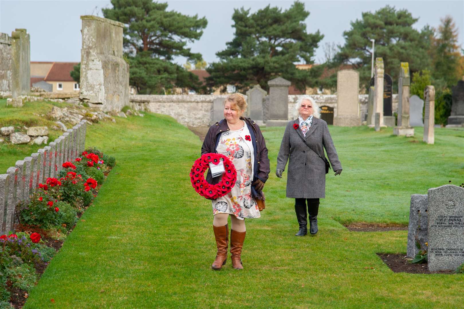 Jenifer O'Hagan of the Findhorn & Kinloss Community Council lays a wreath at the Kinloss Memorial, in the grounds of the Abbey...Remembrance Sunday 2020...Picture: Daniel Forsyth..