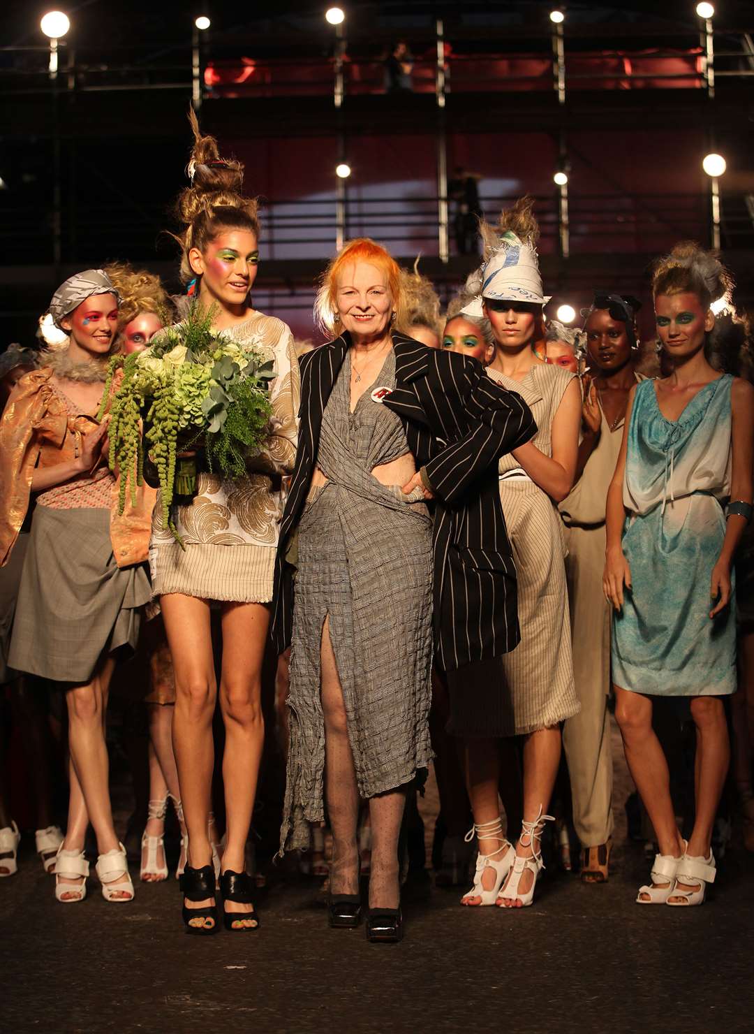 Vivienne Westwood pictured with models at the finale of her Spring/Summer Red Label 2012 show at London Fashion Week (Katie Collins/PA)
