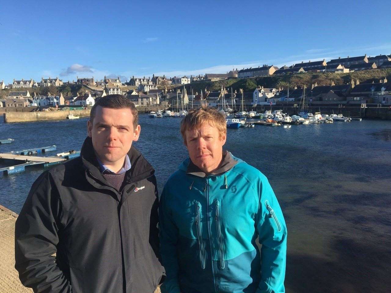 Douglas Ross MP (left) and Councillor Tim Eagle, pictured here prior to social distancing regulations, have welcomed the decision to change burial costs policy. Picture: Moray Conservatives