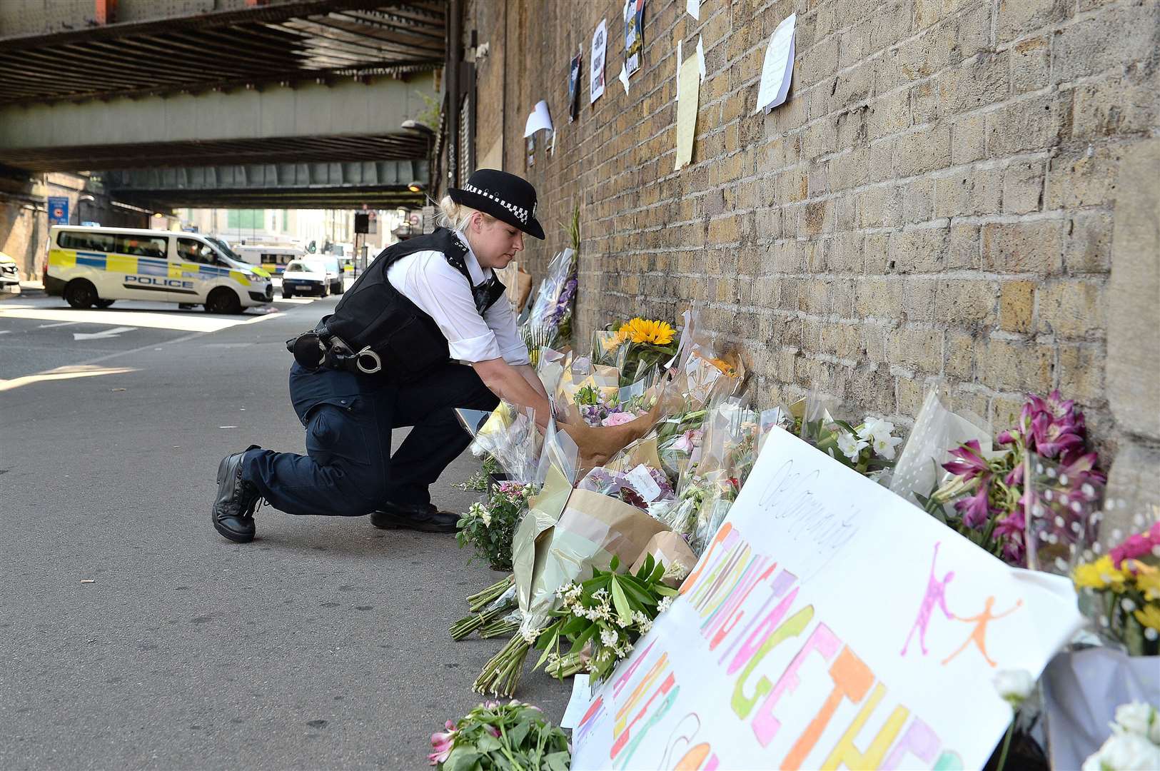 Flowers near Finsbury Park Mosque in north London, after a van struck pedestrians in 2017, killing one man and injuring eight people (John Stillwell/PA)